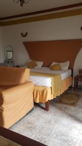 Postel nebo postele na pokoji v ubytování Residencial Cabo Verde Palace