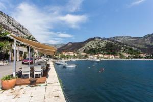 a view of a body of water with boats in it at 2 bedroom apartment with Sea view in Trstenik