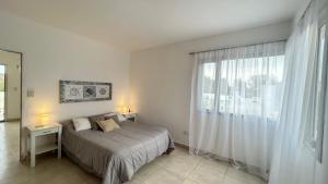 Ένα ή περισσότερα κρεβάτια σε δωμάτιο στο Bonita Casa para 4 en Maco +20 φωτογραφίες