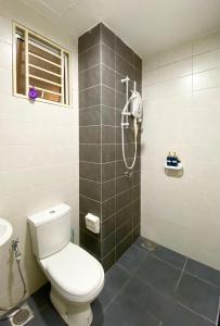 a bathroom with a toilet and a shower at Studio at Mesahill Nilai by D'KAY HOMES with Mall, near USIM KLIA in Nilai