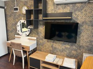 TV a/nebo společenská místnost v ubytování Middle Village