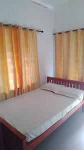 Ένα ή περισσότερα κρεβάτια σε δωμάτιο στο PETERCOTTAGE HOMESTAY +2 φωτογραφίες