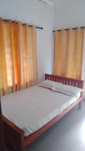 Ένα ή περισσότερα κρεβάτια σε δωμάτιο στο PETERCOTTAGE HOMESTAY