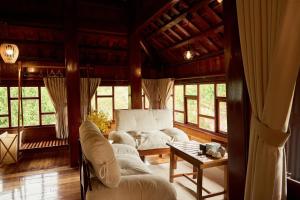 Posezení v ubytování Gỗ Home + 33 fotografií