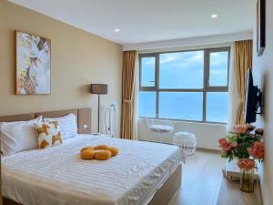 Ένα ή περισσότερα κρεβάτια σε δωμάτιο στο The Song Apartment Vung Tau 5 star-Căn Hộ The Sóng -Moon Homestay +183 φωτογραφίες