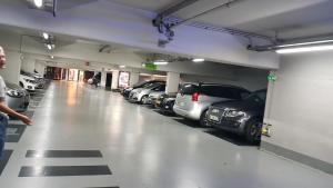 a parking garage with a bunch of cars parked in it at THE COSY HOME Centre ville Parking Clim in Valence