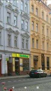 a car parked in front of a large building at Luxusní byt v centru - Free Parking in Karlovy Vary +1 photo