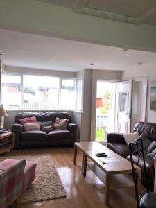 a living room with a couch and a coffee table at Chalet 147 South Shore Bridlington in Bessingby