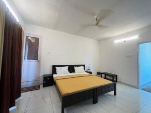 Katil atau katil-katil dalam bilik di Avanthi Homestay