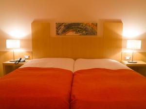Кровать или кровати в номере Hotel Praia