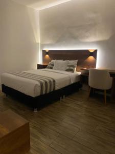 Postel nebo postele na pokoji v ubytování Hotel Rumi