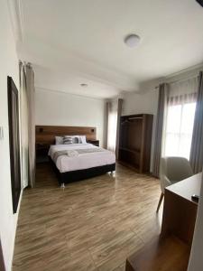 Postel nebo postele na pokoji v ubytování Hotel Rumi