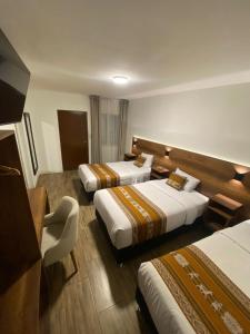 Postel nebo postele na pokoji v ubytování Hotel Rumi