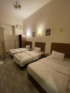 Ένα ή περισσότερα κρεβάτια σε δωμάτιο στο Hello World Hotel