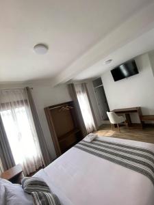 Postel nebo postele na pokoji v ubytování Hotel Rumi