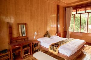 Postel nebo postele na pokoji v ubytování Gỗ Home