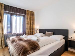 Postel nebo postele na pokoji v ubytování LOU Chalet Apartment Luis