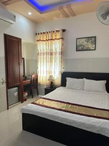 Postel nebo postele na pokoji v ubytování Ngọc Nam Hotel