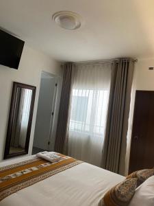 Postel nebo postele na pokoji v ubytování Hotel Rumi