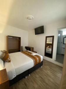 Postel nebo postele na pokoji v ubytování Hotel Rumi