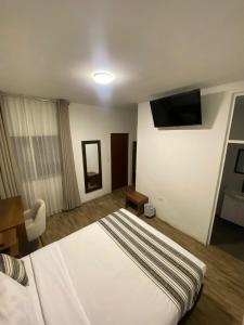 Postel nebo postele na pokoji v ubytování Hotel Rumi
