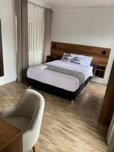 Postel nebo postele na pokoji v ubytování Hotel Rumi