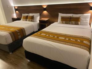 Postel nebo postele na pokoji v ubytování Hotel Rumi