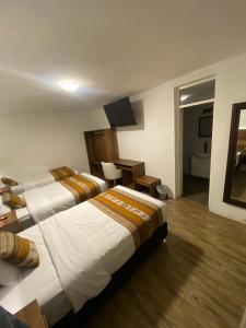 Postel nebo postele na pokoji v ubytování Hotel Rumi