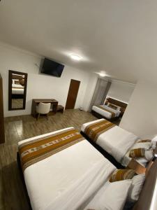 TV a/nebo společenská místnost v ubytování Hotel Rumi