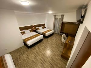 Postel nebo postele na pokoji v ubytování Hotel Rumi