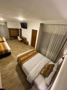 Postel nebo postele na pokoji v ubytování Hotel Rumi