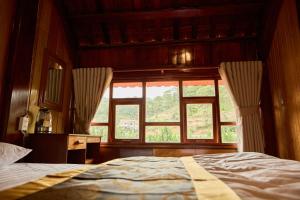 Postel nebo postele na pokoji v ubytování Gỗ Home