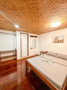 Postel nebo postele na pokoji v ubytování Hangout's Hostel El Nido