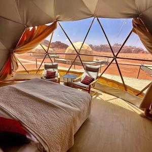 Voodi või voodid majutusasutuse Youssef camp Wadi Rum toas