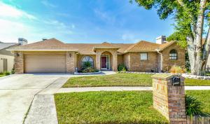 a large brick house with a garage at Zen Oasis - Royal Pool Paradise Near Tampa in Brandon