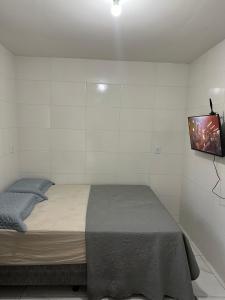 Postel nebo postele na pokoji v ubytování Cantinho Aconchegante - Quarto 04 Ar-condicionado
