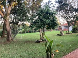 a field with two trees and a soccer goal at Khaled Estate Cottages - unit A in Hillcrest