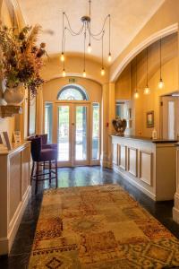 a large room with a kitchen and a dining room at The Falcondale at Lampeter in Lampeter
