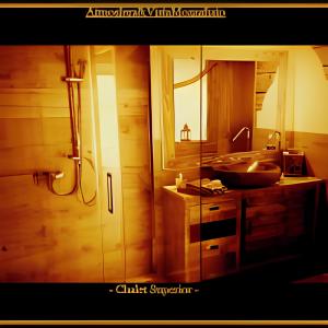 a bathroom with a sink and a mirror at CHALET con JACUZZI VISTA MONTAGNE in Aosta