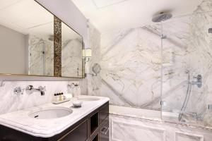 a bathroom with a sink and a shower at Hotel Bristol, A Luxury Collection Hotel, Warsaw in Warsaw