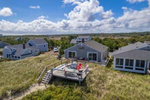 an aerial view of a house with a dock at 215 Phillips Road Sagamore Beach - Cape Cod in Sagamore Beach