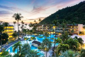 an aerial view of a resort with palm trees at Phuket Marriott Resort & Spa, Merlin Beach in Patong Beach