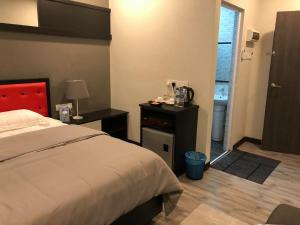 Ένα ή περισσότερα κρεβάτια σε δωμάτιο στο Hotel Mayazia Kota Bharu +13 φωτογραφίες
