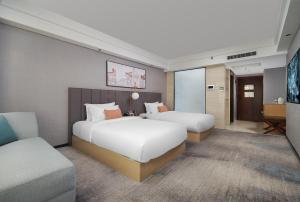 Mehood Lestie International Hotel Linhexi Guangzhou East Railway Station Branch - Free Shuttle Bus to Canton Fair Complex During Canton Fair Period & Free afternoon tea & Free midnight snack & Free VPN Internet Access客房内的一张或多张床位