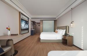 Mehood Lestie International Hotel Linhexi Guangzhou East Railway Station Branch - Free Shuttle Bus to Canton Fair Complex During Canton Fair Period & Free afternoon tea & Free midnight snack & Free VPN Internet Access客房内的一张或多张床位