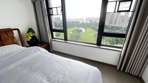 Peicui Apartment客房内的一张或多张床位