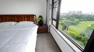 Peicui Apartment客房内的一张或多张床位