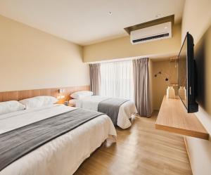 Voodi või voodid majutusasutuse Brown House Hotel - Taipei Main Station toas