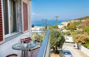 a balcony with a table and a view of the ocean at "Thea" Apartment 2 in Skala Marion