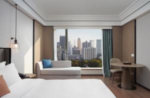 Mehood Lestie International Hotel Linhexi Guangzhou East Railway Station Branch - Free Shuttle Bus to Canton Fair Complex During Canton Fair Period & Free afternoon tea & Free midnight snack & Free VPN Internet Access客房内的一张或多张床位